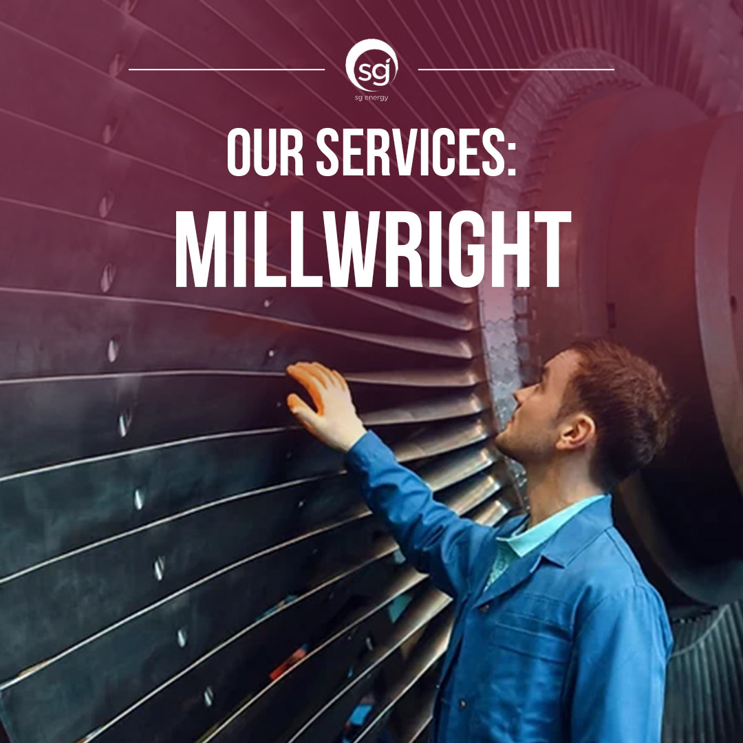 A man in blue coat inspecting large industrial turbine blades, millwright services and turbine maintenance