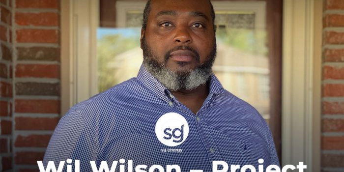 New hire announcement portrait of a man in blue check shirt on a brick porch, Project Coordinator welcome graphic