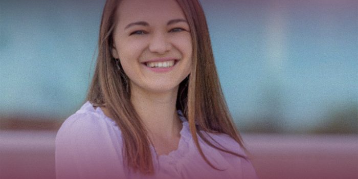 HR supervisor headshot, smiling woman in Team Spotlight graphic with SG Energy maroon overlay